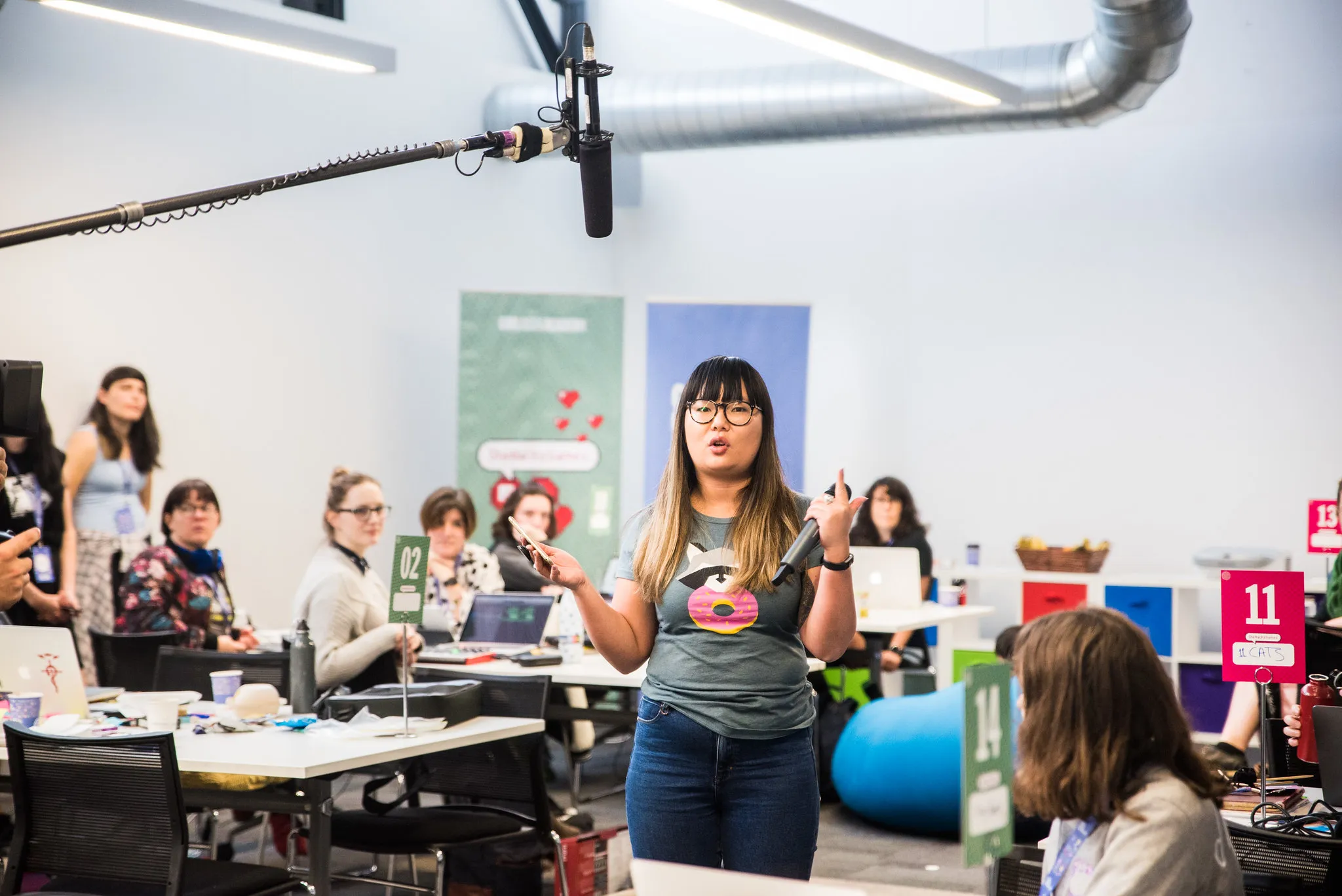 A speaker presenting to a room of participants
